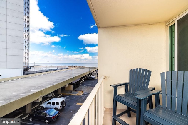 balcony featuring a water view