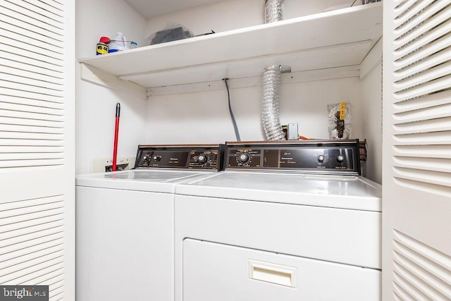 laundry area featuring washing machine and clothes dryer