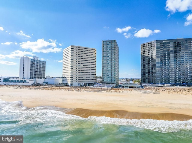 exterior space featuring a view of the beach and a water view