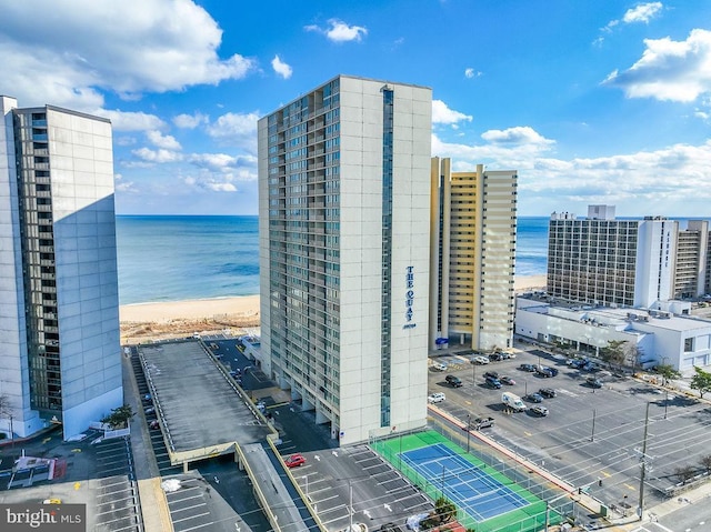 exterior space featuring a water view and a view of the beach