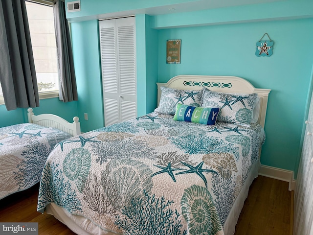 bedroom featuring a closet and hardwood / wood-style floors