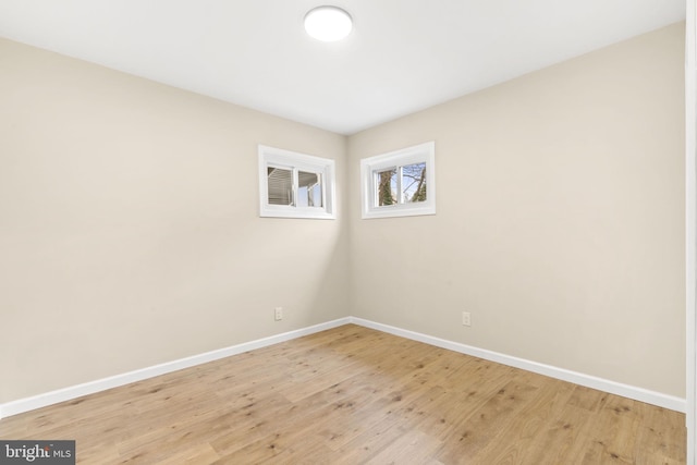 spare room featuring light wood-type flooring