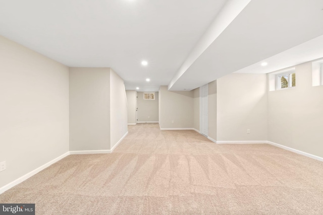 basement with light colored carpet