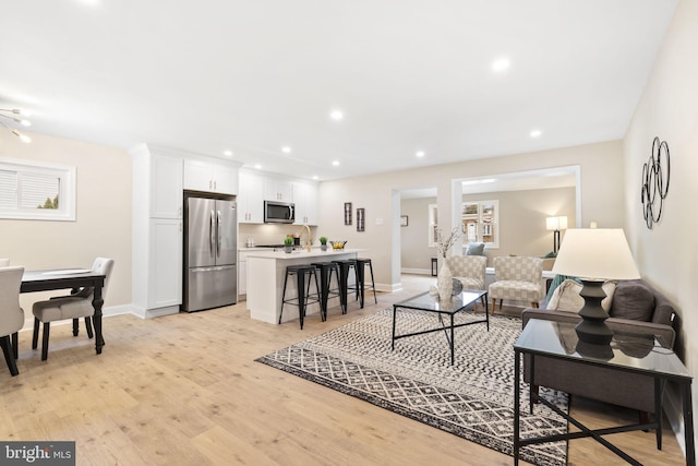 living room with light hardwood / wood-style floors