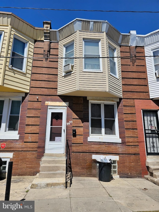 view of front of property with cooling unit