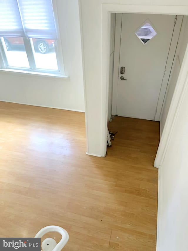 corridor featuring light hardwood / wood-style flooring