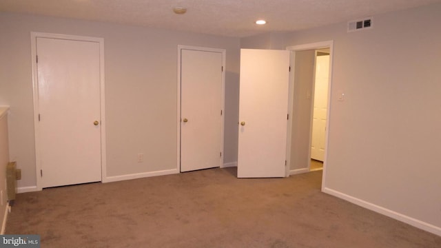 unfurnished bedroom with carpet