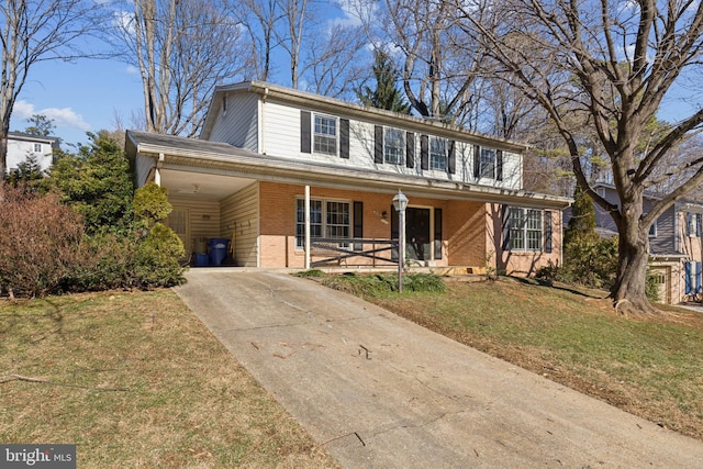 view of front of property with a front yard, a carport, and a porch