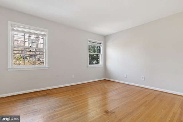 unfurnished room featuring light hardwood / wood-style floors