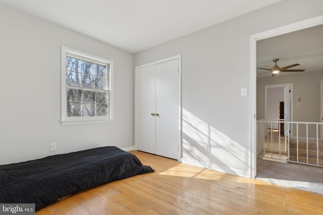 bedroom with a closet and light hardwood / wood-style flooring