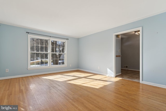 unfurnished room with light hardwood / wood-style flooring