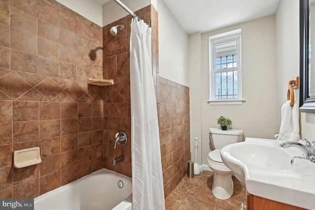 full bathroom featuring toilet, vanity, and shower / bath combination with curtain