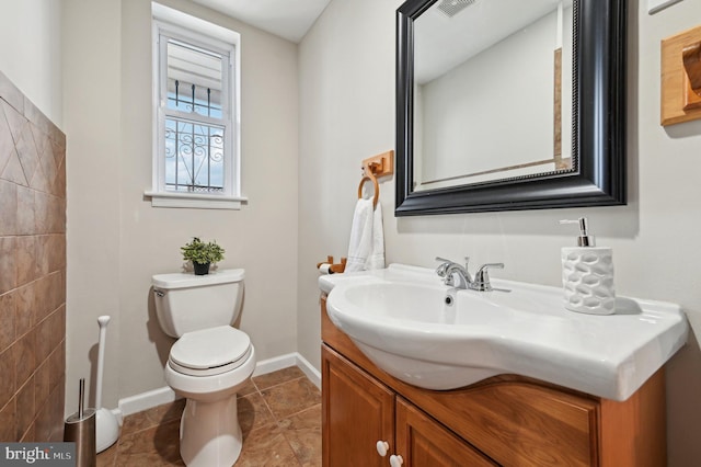 bathroom with toilet and vanity