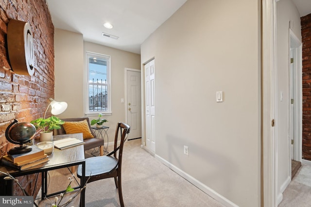 office area featuring light colored carpet