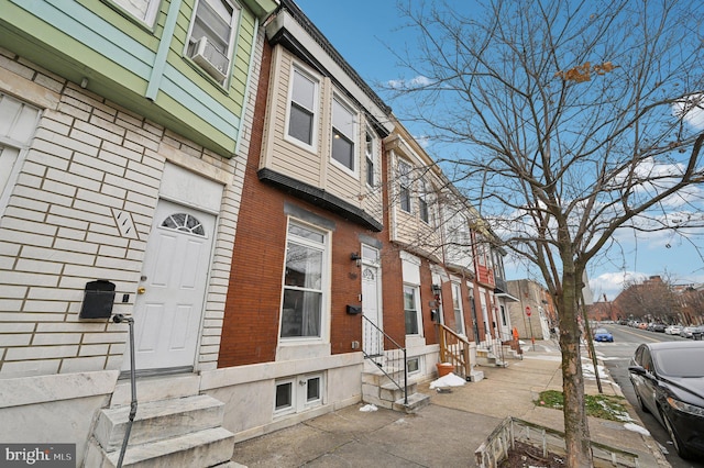 view of side of property with cooling unit