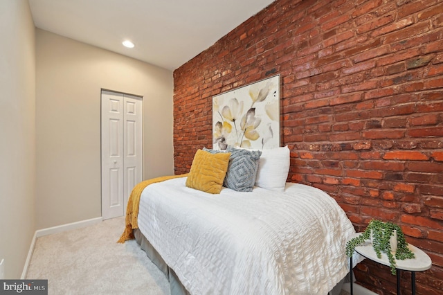 carpeted bedroom featuring a closet