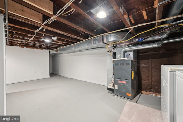 basement with separate washer and dryer and heating unit