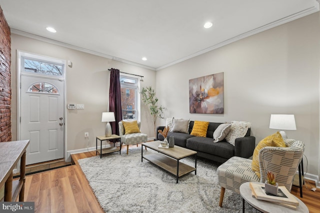 living room featuring hardwood / wood-style floors and ornamental molding