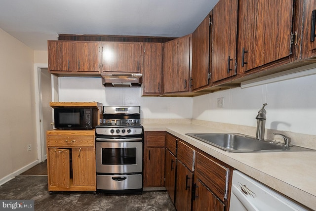 kitchen featuring sink, white dishwasher, and stainless steel range with gas cooktop