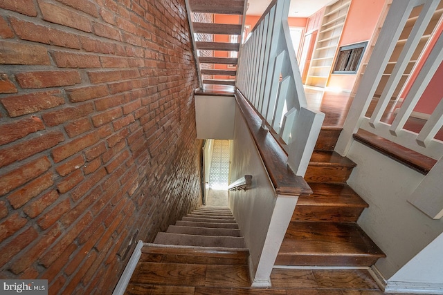 stairs with brick wall