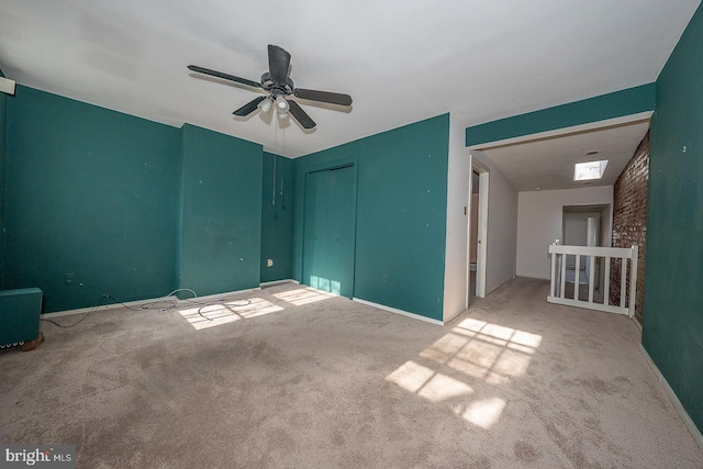 unfurnished bedroom featuring a closet, ceiling fan, and carpet flooring