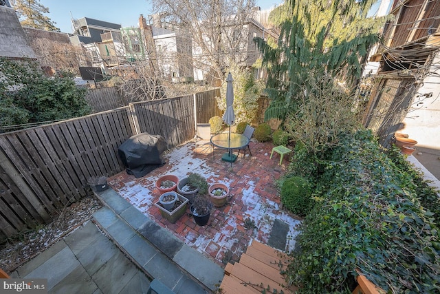 view of patio featuring a grill