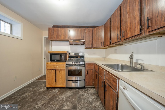 kitchen with stainless steel gas range oven, dishwasher, and sink