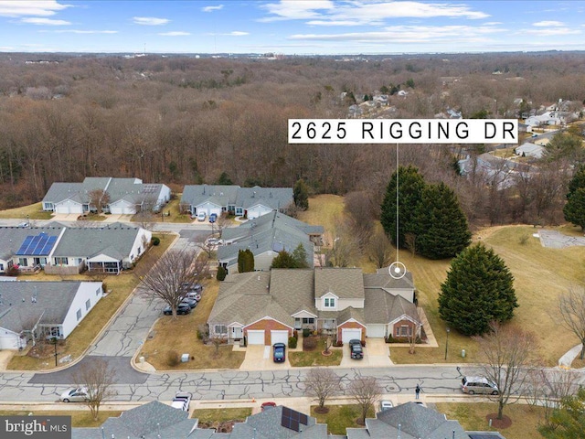 birds eye view of property with a residential view