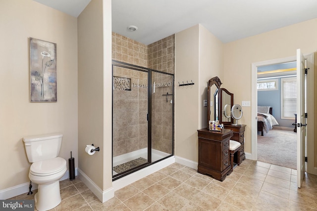 bathroom with toilet, an enclosed shower, and tile patterned floors