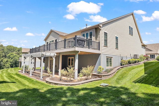 rear view of house with central AC unit, a lawn, and a pergola