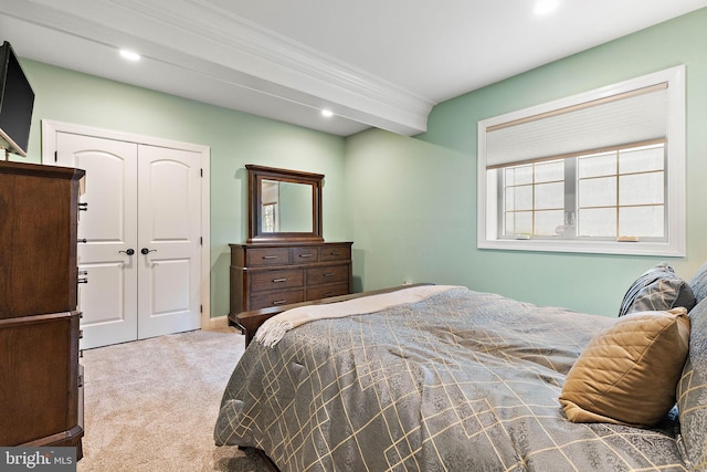 carpeted bedroom featuring a closet