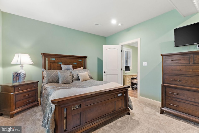 bedroom with light colored carpet