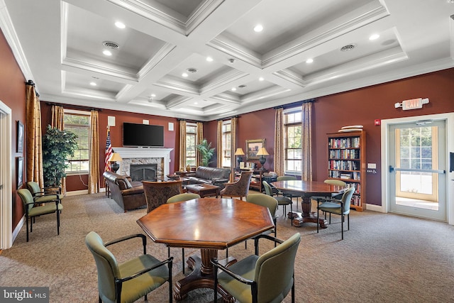 carpeted dining room with coffered ceiling, a fireplace, crown molding, and beamed ceiling