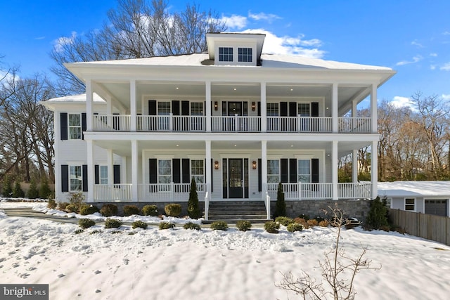 view of front of house featuring a porch and a balcony