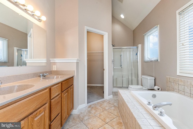 full bathroom featuring tile patterned flooring, vaulted ceiling, toilet, vanity, and independent shower and bath