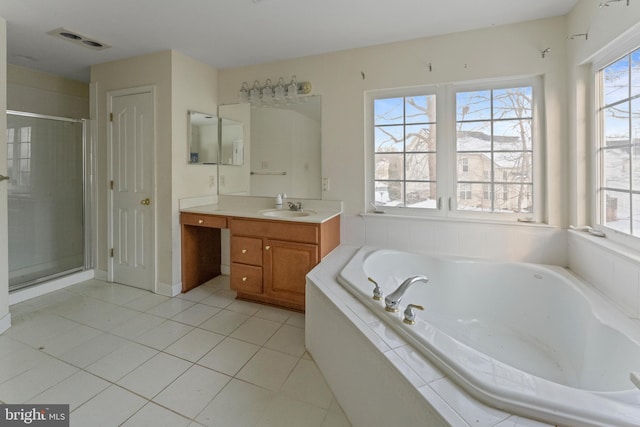 bathroom featuring shower with separate bathtub, tile patterned floors, and vanity