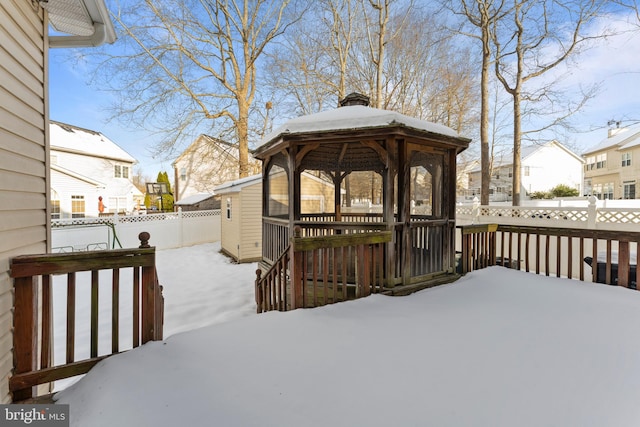 snow covered deck featuring a gazebo