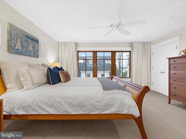 bedroom featuring ceiling fan and carpet floors