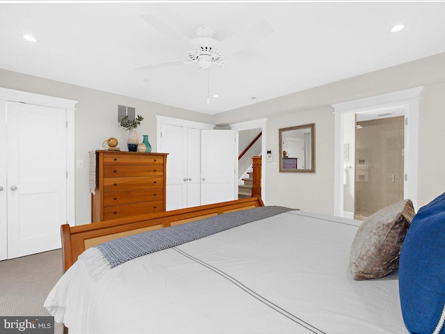 bedroom featuring carpet, a closet, connected bathroom, and ceiling fan