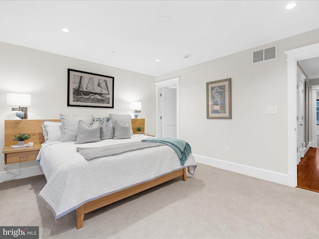 bedroom with light carpet