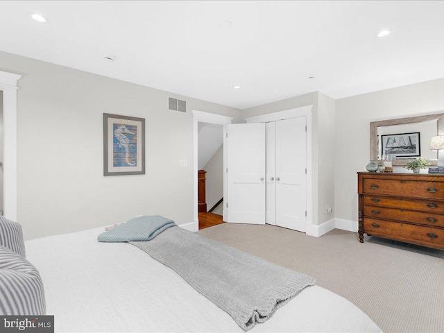 carpeted bedroom featuring a closet