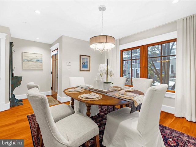 dining area with light hardwood / wood-style flooring