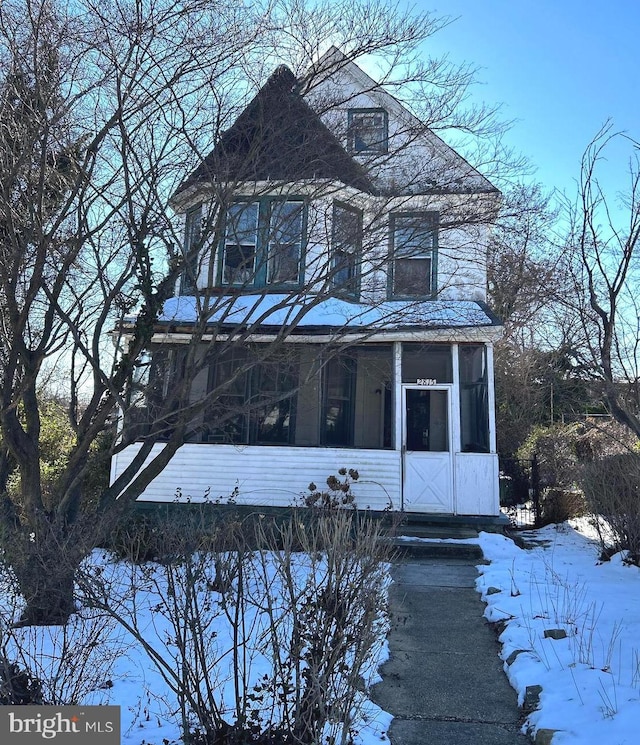 view of front facade featuring a sunroom