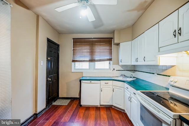 kitchen featuring white appliances, dark hardwood / wood-style flooring, white cabinets, and sink