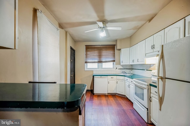 kitchen with white cabinetry, white appliances, ceiling fan, decorative backsplash, and dark hardwood / wood-style floors