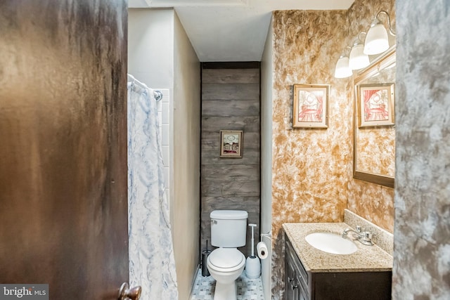 bathroom with toilet and vanity