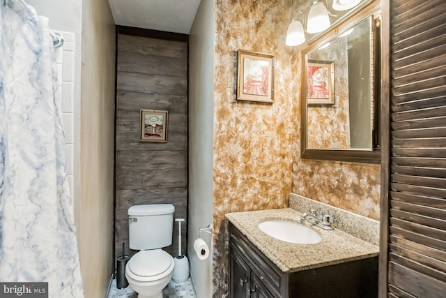 bathroom with toilet and vanity