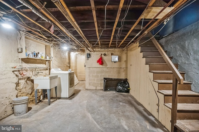 basement with sink and independent washer and dryer