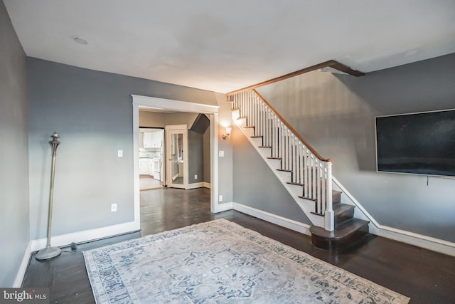 stairway featuring hardwood / wood-style flooring