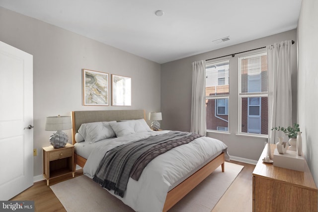 bedroom featuring light hardwood / wood-style floors